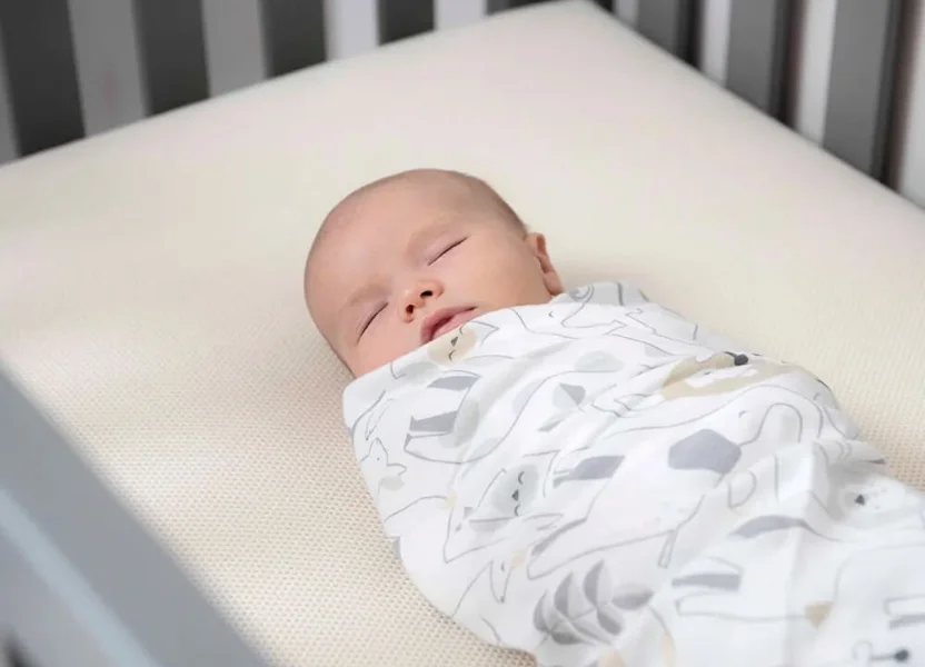 baby sleeping on naturepedic mattress